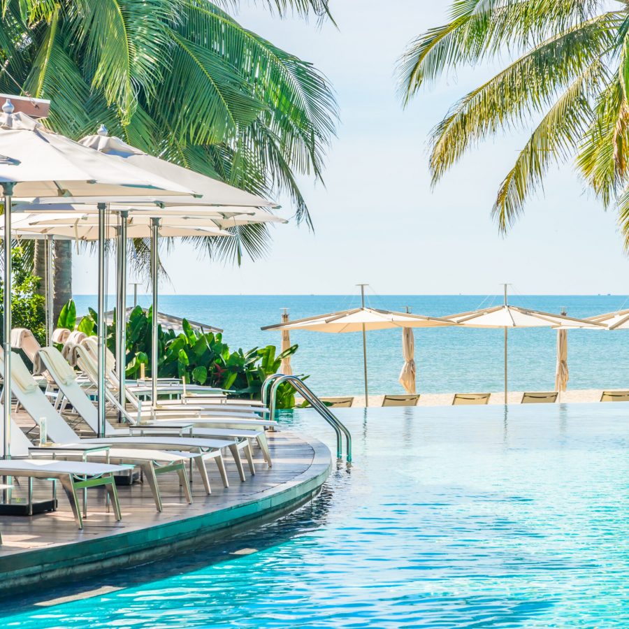 Umbrella with chair in hotel  swimming pool resort